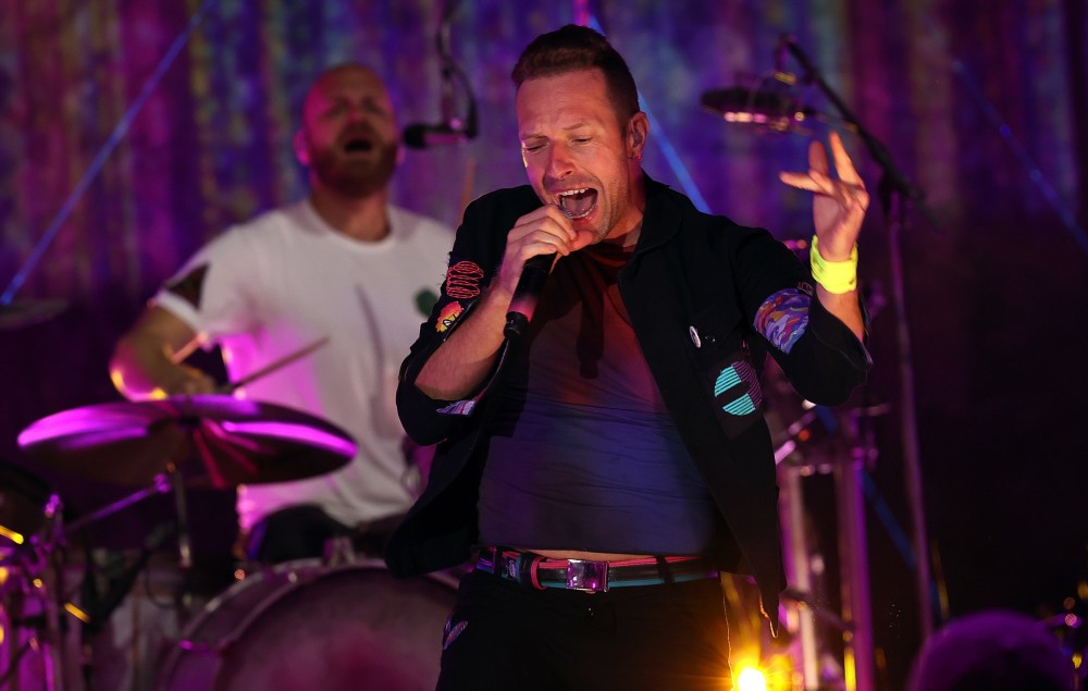 Chris Martin performing live with Coldplay