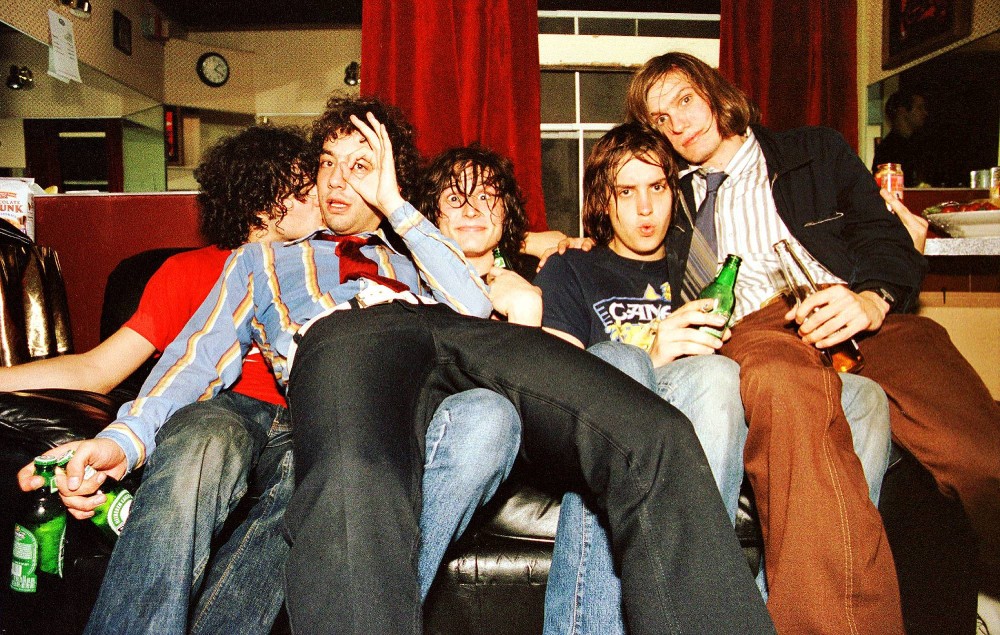 Portrait of The Strokes backstage at The Fillmore, San Francisco, California, USA on 16th October 2001, L-R Fabrizio Moretti, Albert Hammond Jr, Nick Valensi, Julian Casablancas and Nikolai Fraiture. (Photo by Anthony PIdgeon/Redferns)