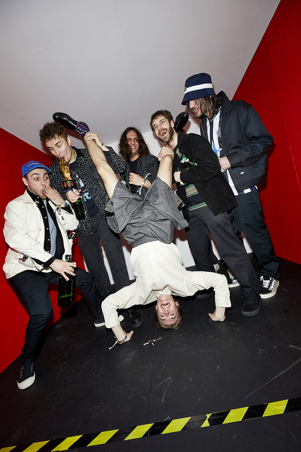 Sam Fender, his band and TikTok star Francis Bourgeois pose at the BandLab NME Awards