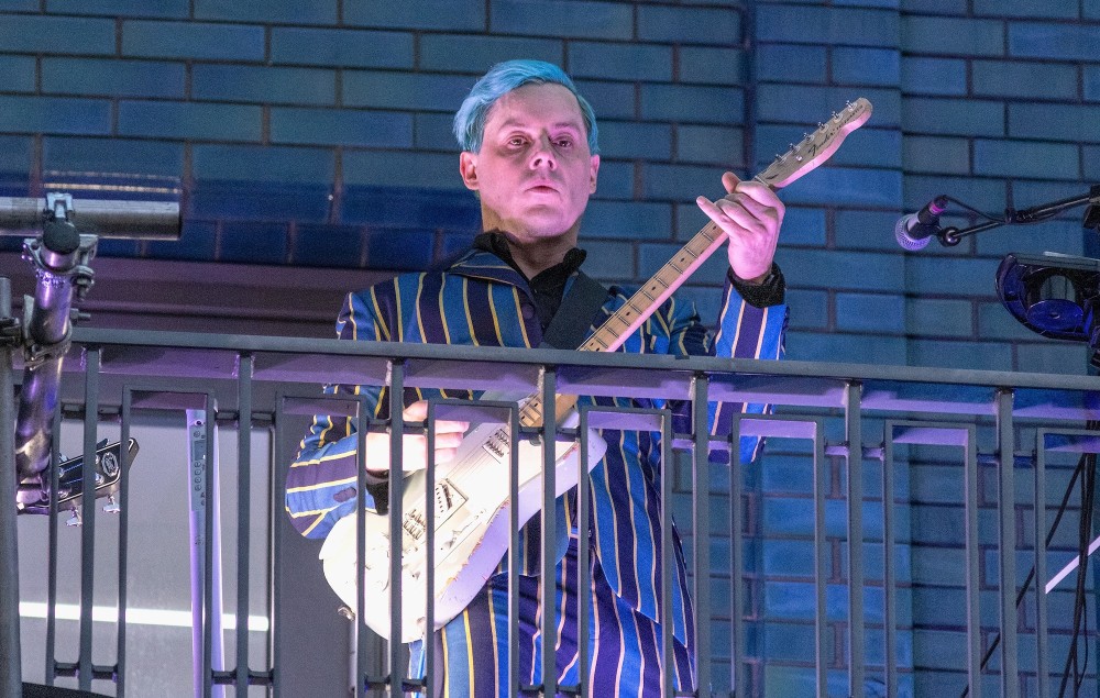 Jack White performs from a balcony on Marshall Street