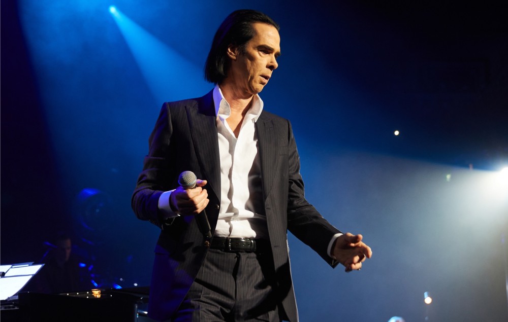 Nick Cave performing live on stage in 2021