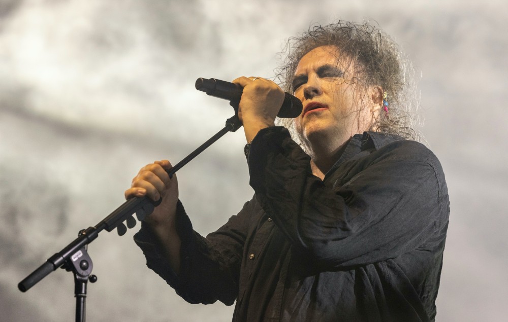 Robert Smith performing live on-stage with The Cure in 2022