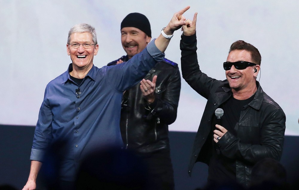Bono of U2 and Apple CEO Tim Cook pose in a picture