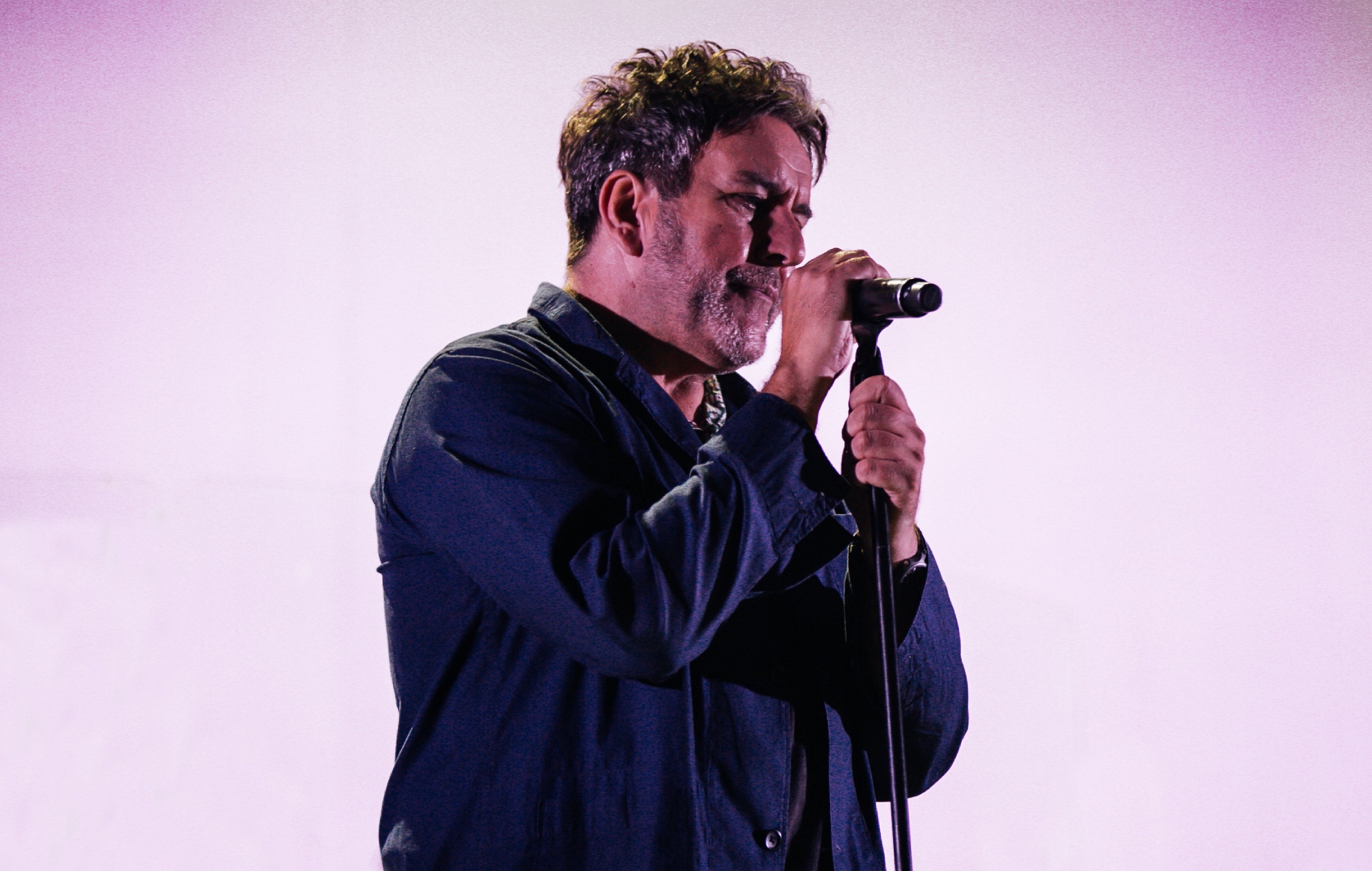 Terry Hall performing live onstage with The Specials in 2021