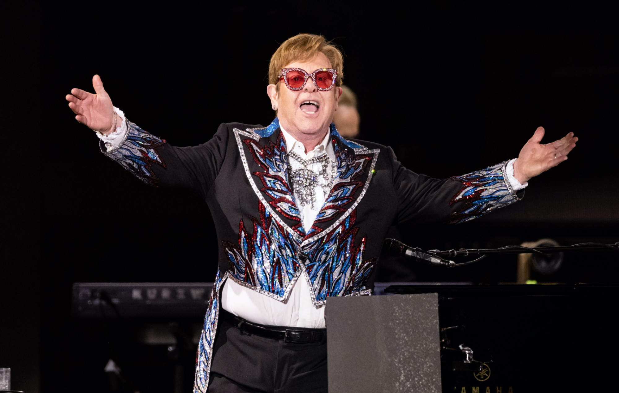 Elton John performing live on-stage