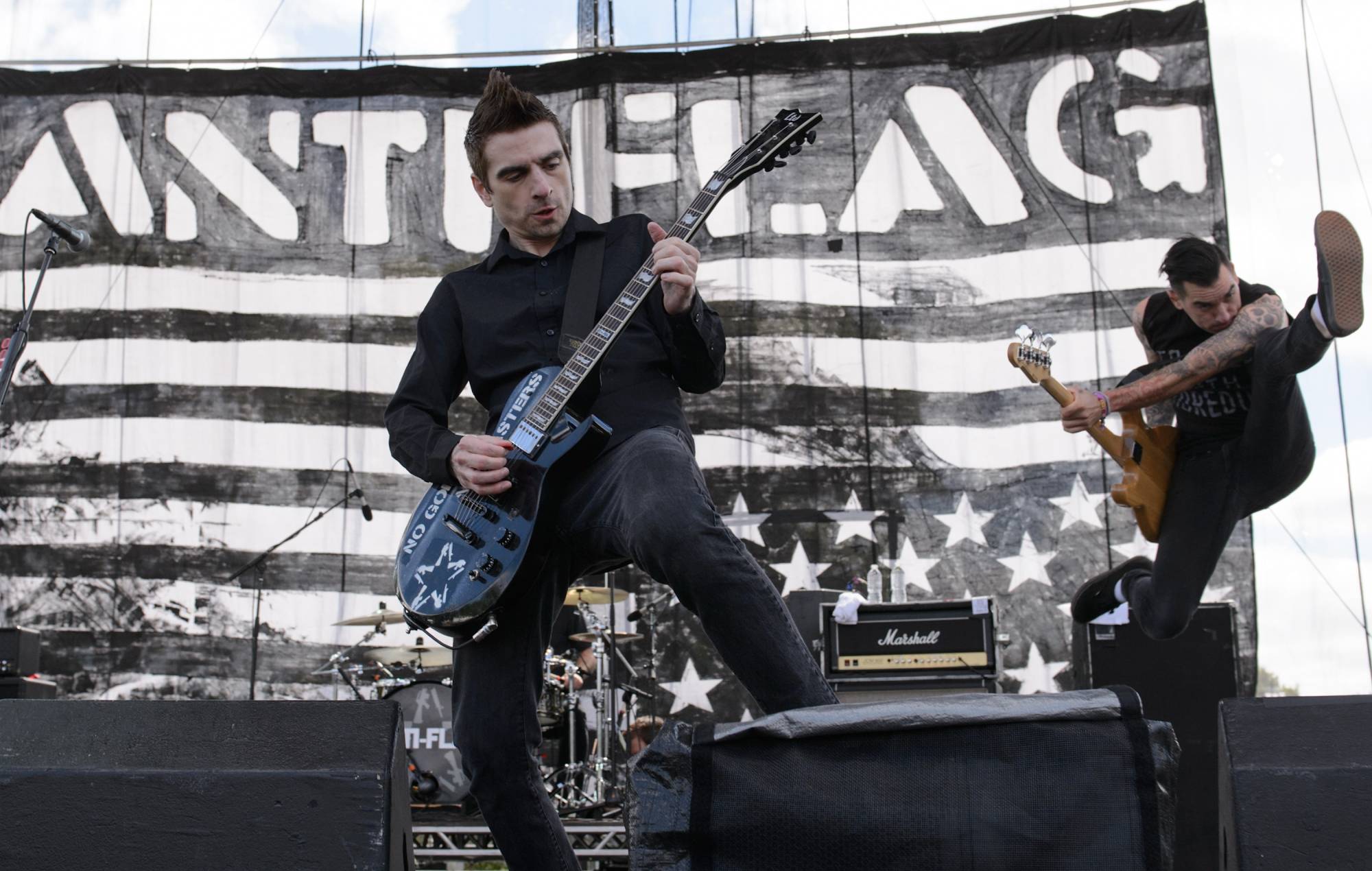 Justin Sane and Chris Head of Anti-Flag perform on stage at Riot Fest Chicago 2014 at Humboldt Park on September 13, 2014 in Chicago, United States. Credit: Daniel Boczarski/GETTY