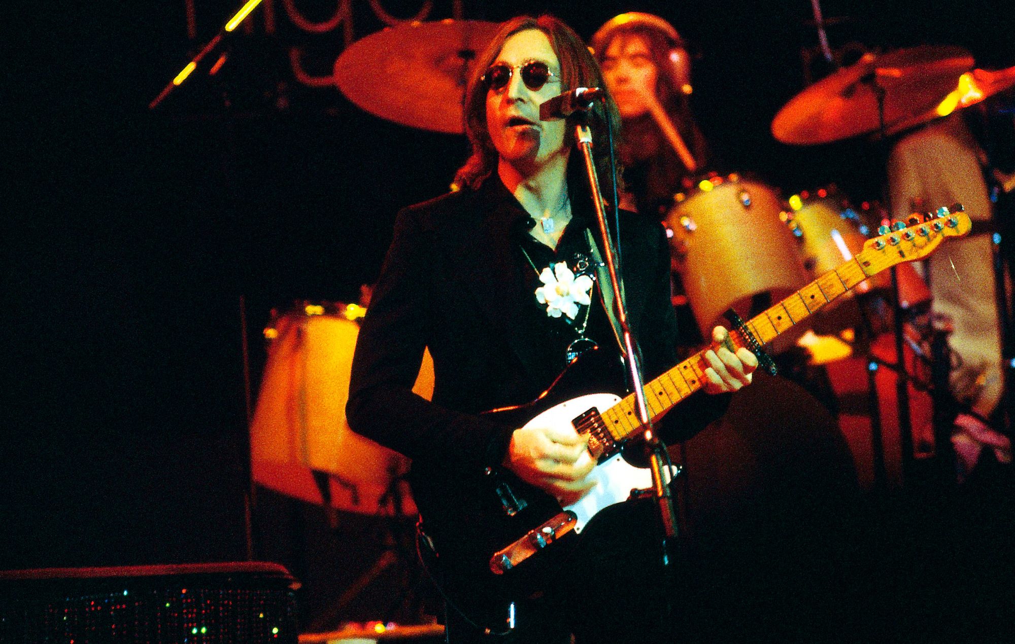 Photo of John Lennon performing live onstage during his last live appearance.
