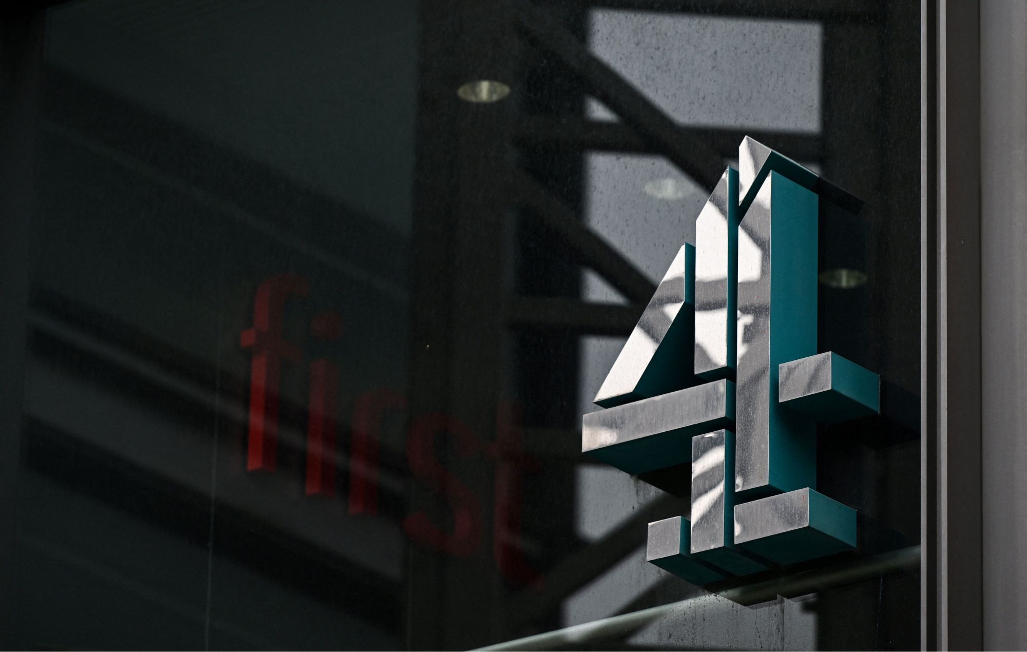 A photograph taken on April 5, 2022 shows the logo of Channel 4 at the TV network headquarters in London, as Britain's government plans to privatise the television channel.