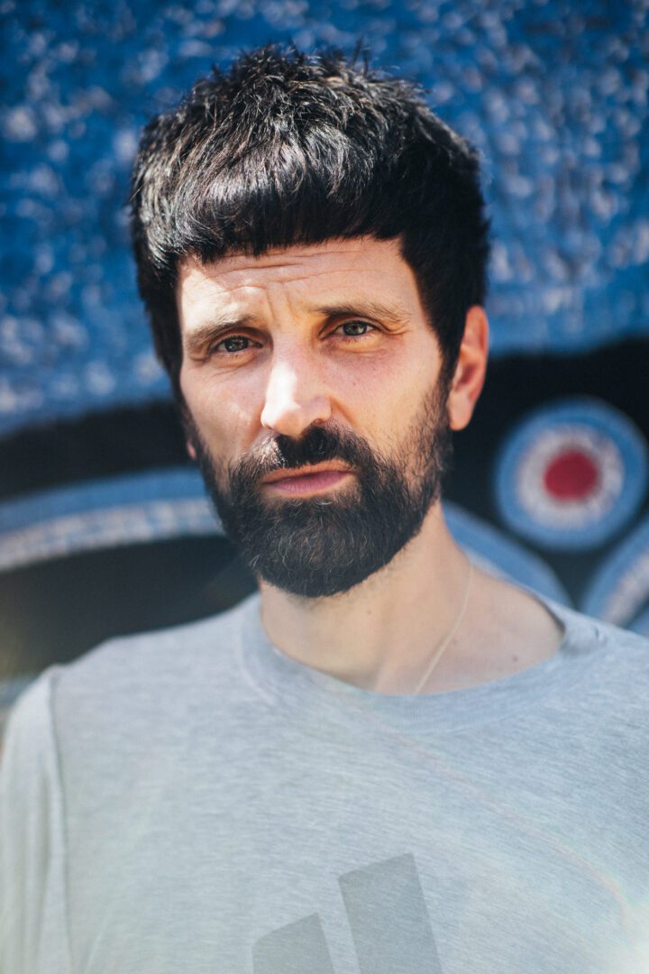 Kasabian's Serge Pizzorno backstage at Glastonbury 2024. Credit: Andy Ford for NME