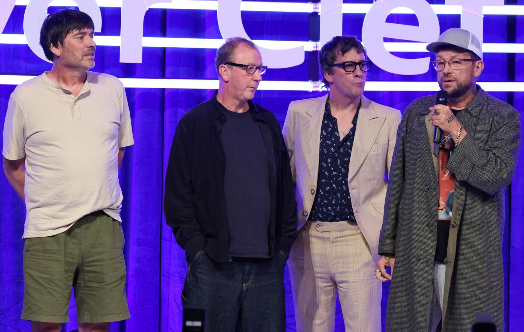 Dave Rowntree, Damon Albarn , Alex James and Graham Coxon of Blur speak onstage in 2024