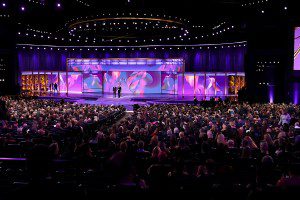 LOS ANGELES, CALIFORNIA - SEPTEMBER 15: (L-R) Hosts Eugene Levy and Dan Levy speak onstage during the 76th Primetime Emmy Awards at Peacock Theater on September 15, 2024 in Los Angeles, California.  (Photo by Leon Bennett/WireImage)