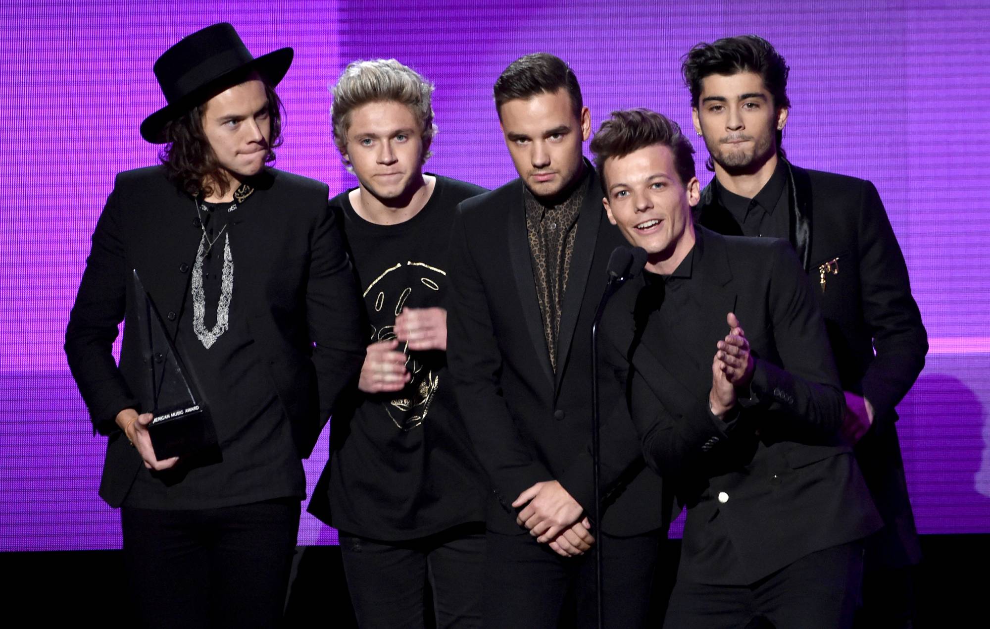 One Direction accept the Favorite Pop/Rock Band/Duo/Group award onstage at the 2014 American Music Awards. (Photo by Kevin Winter/Getty Images)