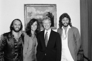 (Original Caption) 9/24/1979-Washington, DC: The famed rock group The Bee Gees visited President Carter at the White House 9/24. All brothers with the last name Gibb, they are, L to R: Maurice; Robin; President Carter and Barry.