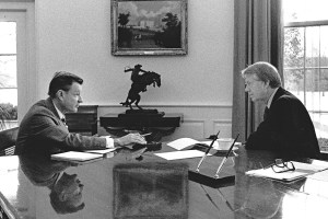 US National Security Advisor Dr Zbigniew Brzezinski (1928 - 2017) (left) speaks with US President Jimmy Carter in the White House's Oval Office, Washington DC, January 21, 1977. The meeting took place on the President's first, full day in office. (Photo by White House via CNP/Getty Images)