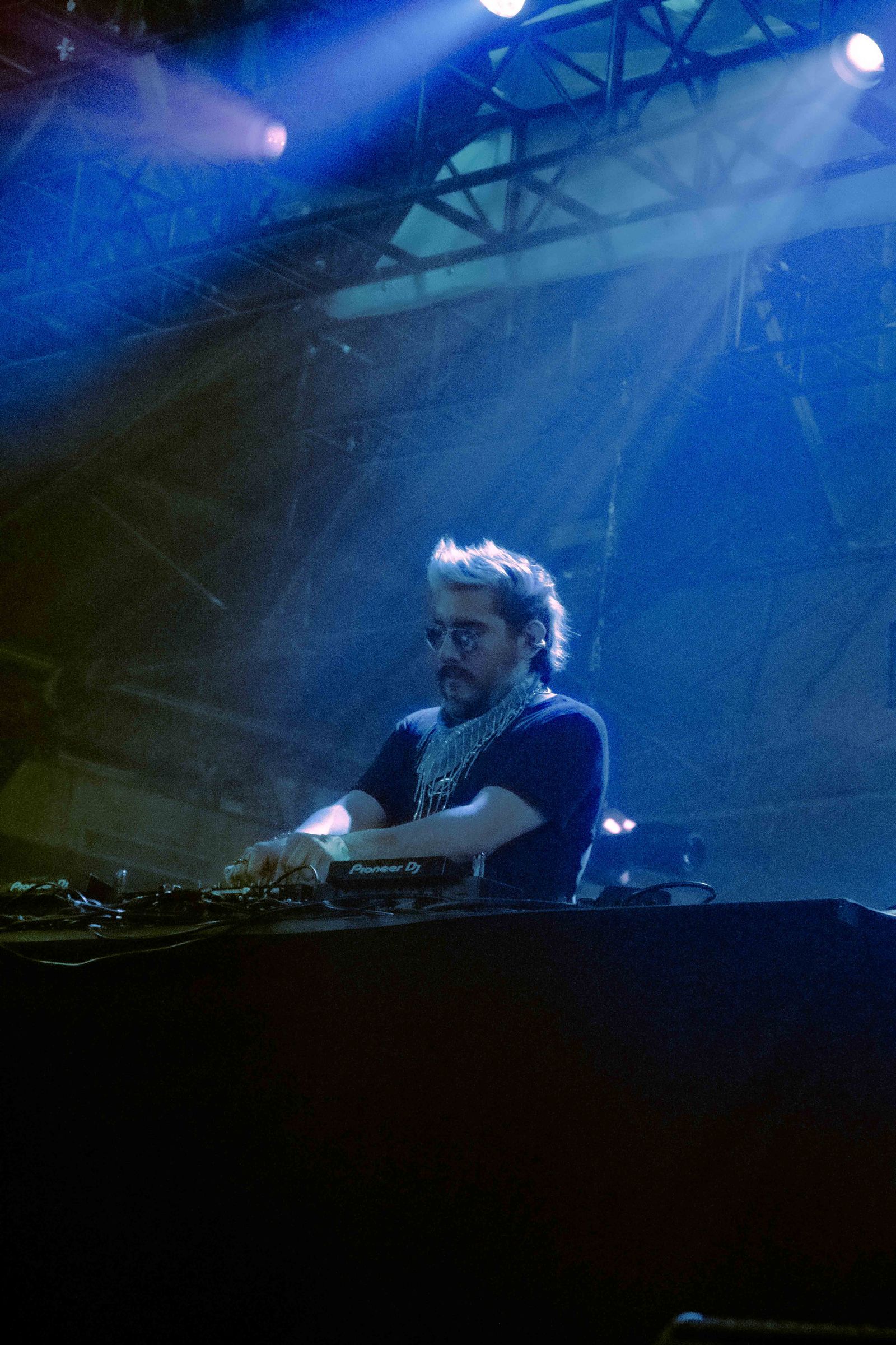 Image may contain Lighting Concert Crowd Person Adult Face Head Photography Portrait Accessories and Jewelry